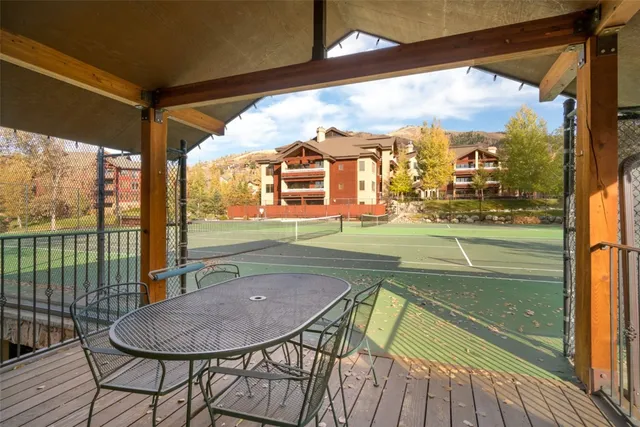 a living room with furniture kitchen view and a dining table