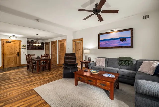 a reading room with furniture and wooden floor