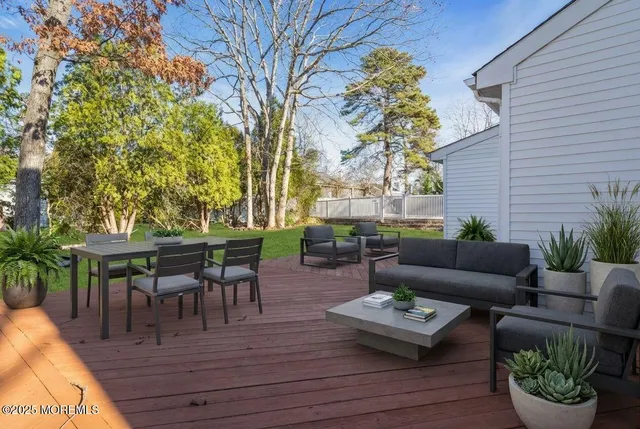 a view of a swimming pool with an outdoor seating