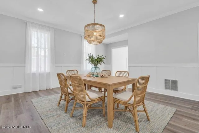 a dining room with furniture and window