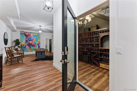 a view of a living room with furniture and wooden floor