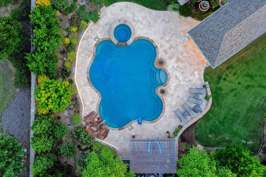 6656 Roughleaf Ridge Road Flower Mound, TX 76226 - Photo 35 of 40 an aerial view of a house with a swimming pool and garden
