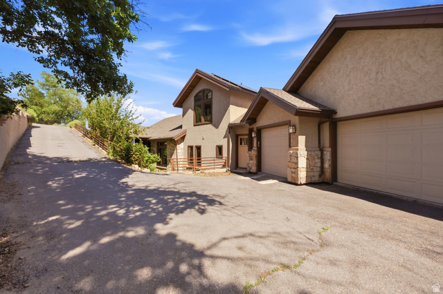 335 Bern Way Midway, UT 84049 - Photo 78 of 88 Multi-car garage with tan doors and stone-clad pillars