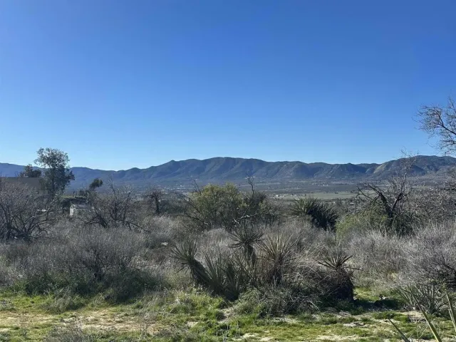 a view of a lake with mountains in the background