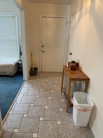 a view of a room with a furniture and a window