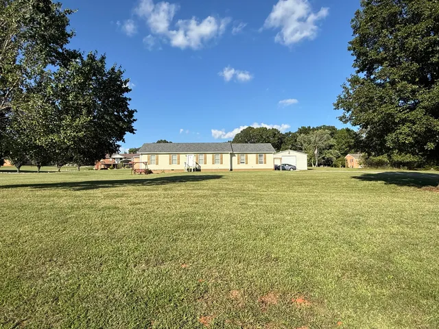 a large body of water with a building in the background