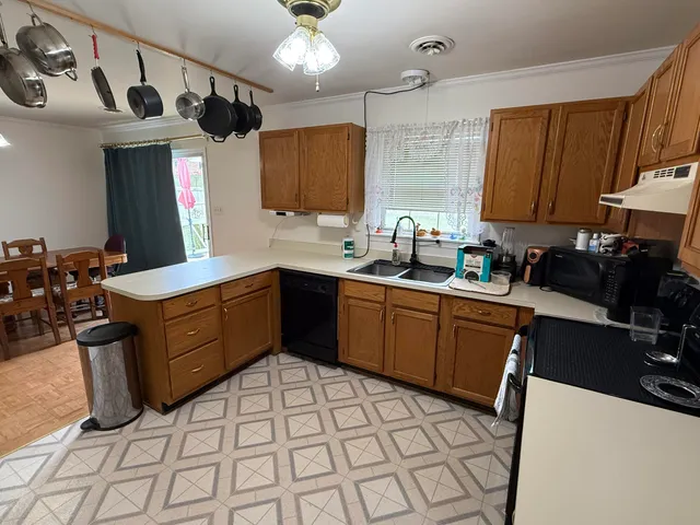 a kitchen with a sink stove and microwave