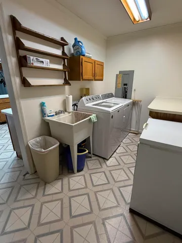 a living room with a couch and a stove top oven