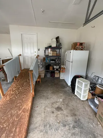 a bed room with a bed and a chair