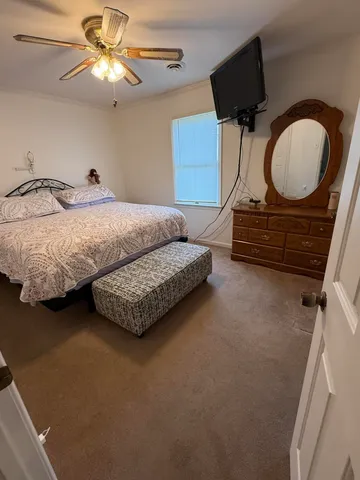 a living room with furniture and a mirror