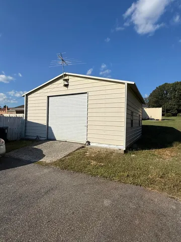 a front view of a house with a garage