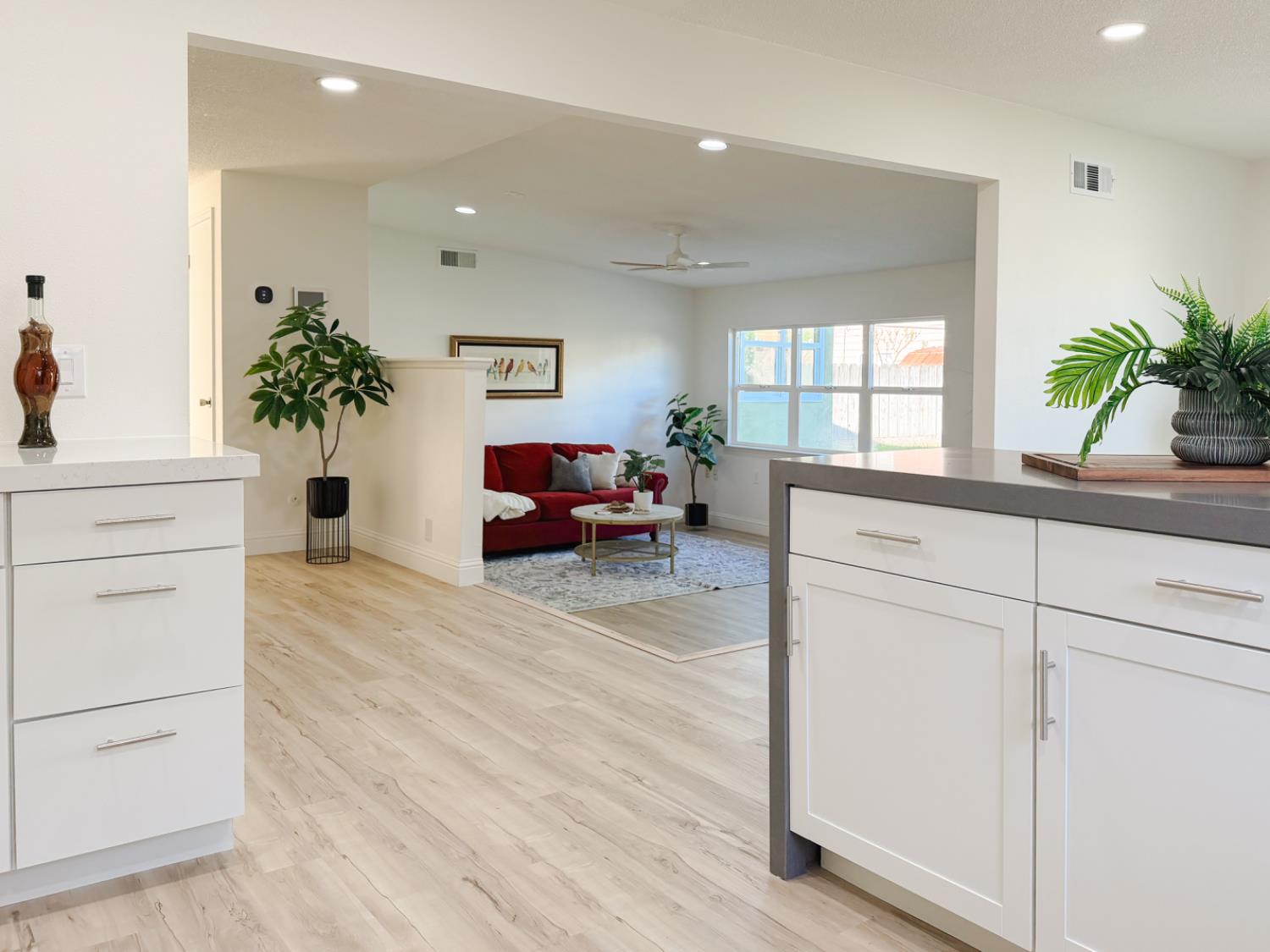 878 Carol Avenue Merced, CA 95341 - Photo 13 of 41 a living room with furniture a potted plant and a window