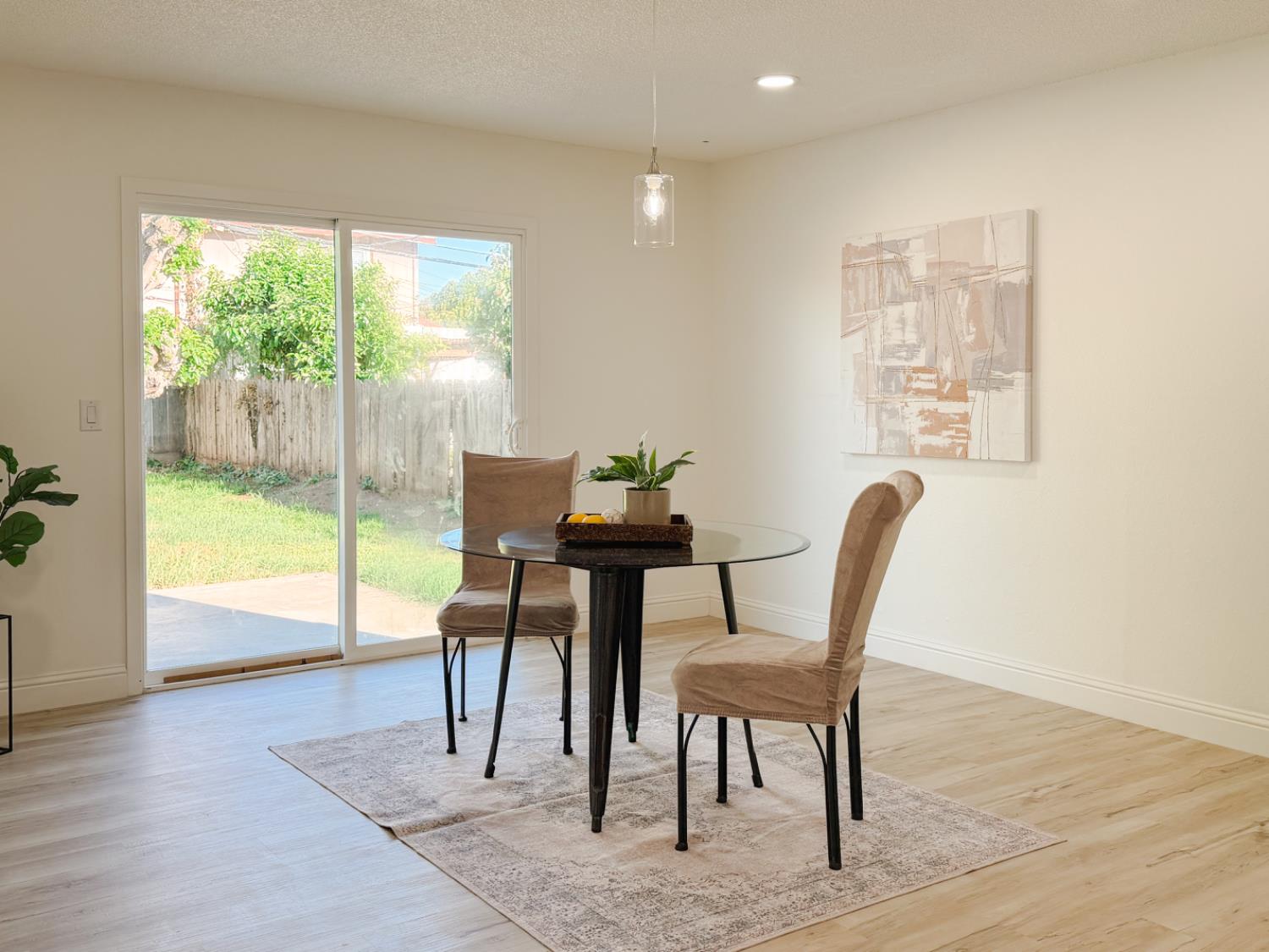 878 Carol Avenue Merced, CA 95341 - Photo 17 of 41 a view of a dining room with furniture window and wooden floor