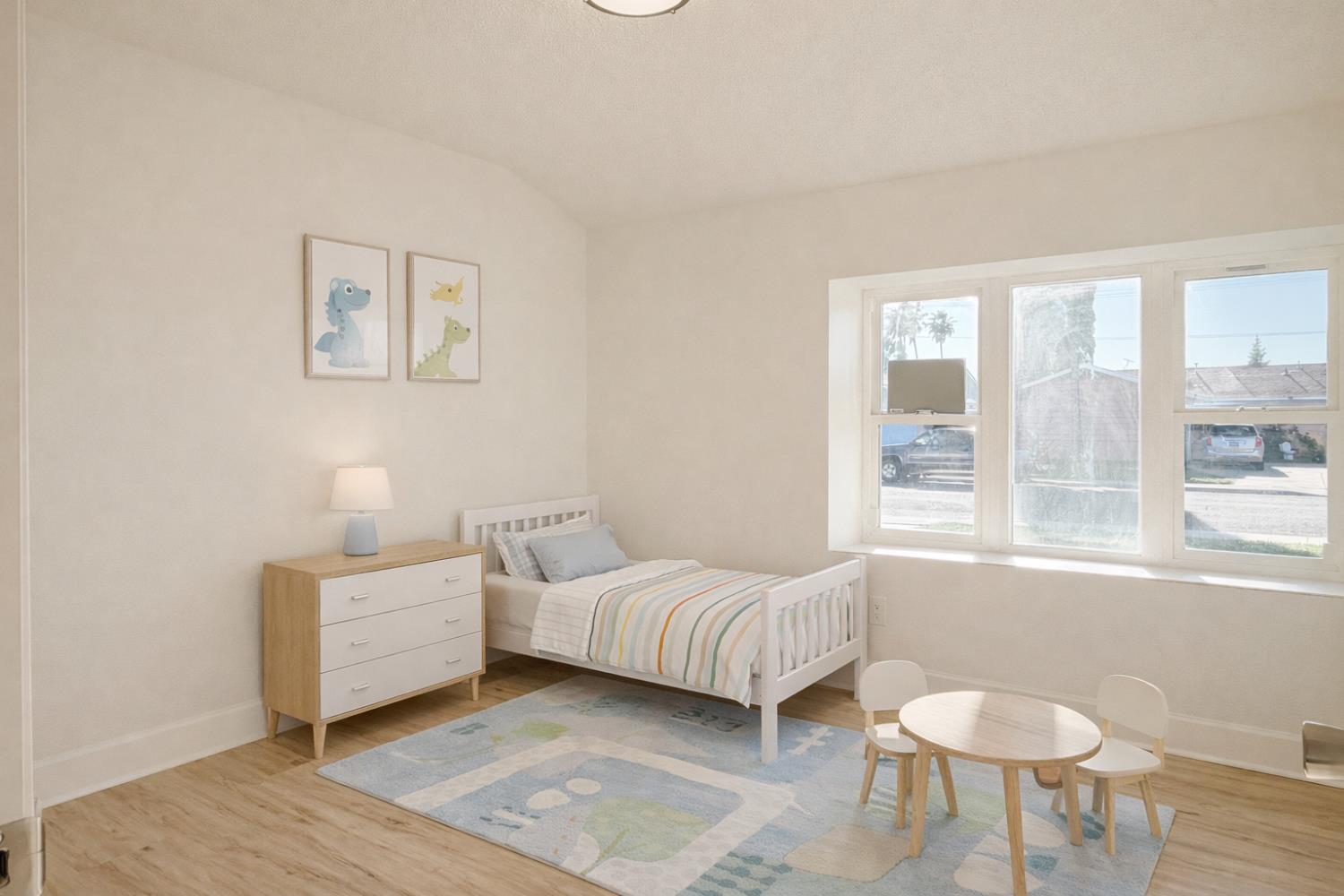 878 Carol Avenue Merced, CA 95341 - Photo 19 of 41 a bedroom with a bed and a window