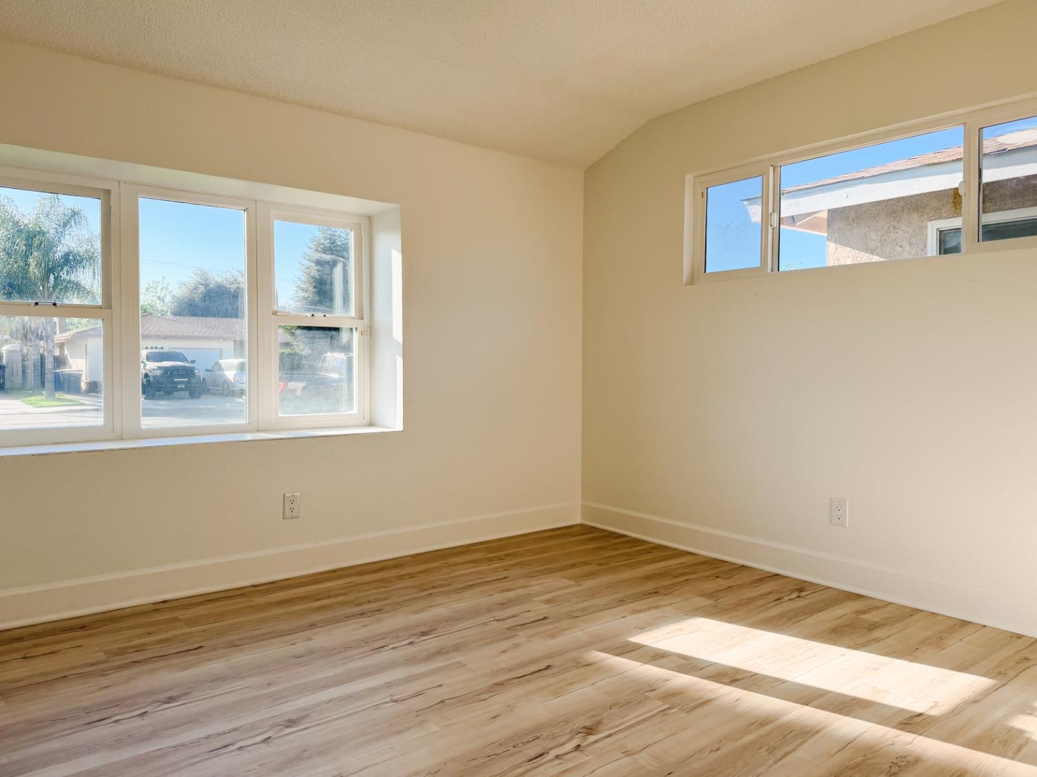 878 Carol Avenue Merced, CA 95341 - Photo 23 of 41 a view of empty room with wooden floor and fan
