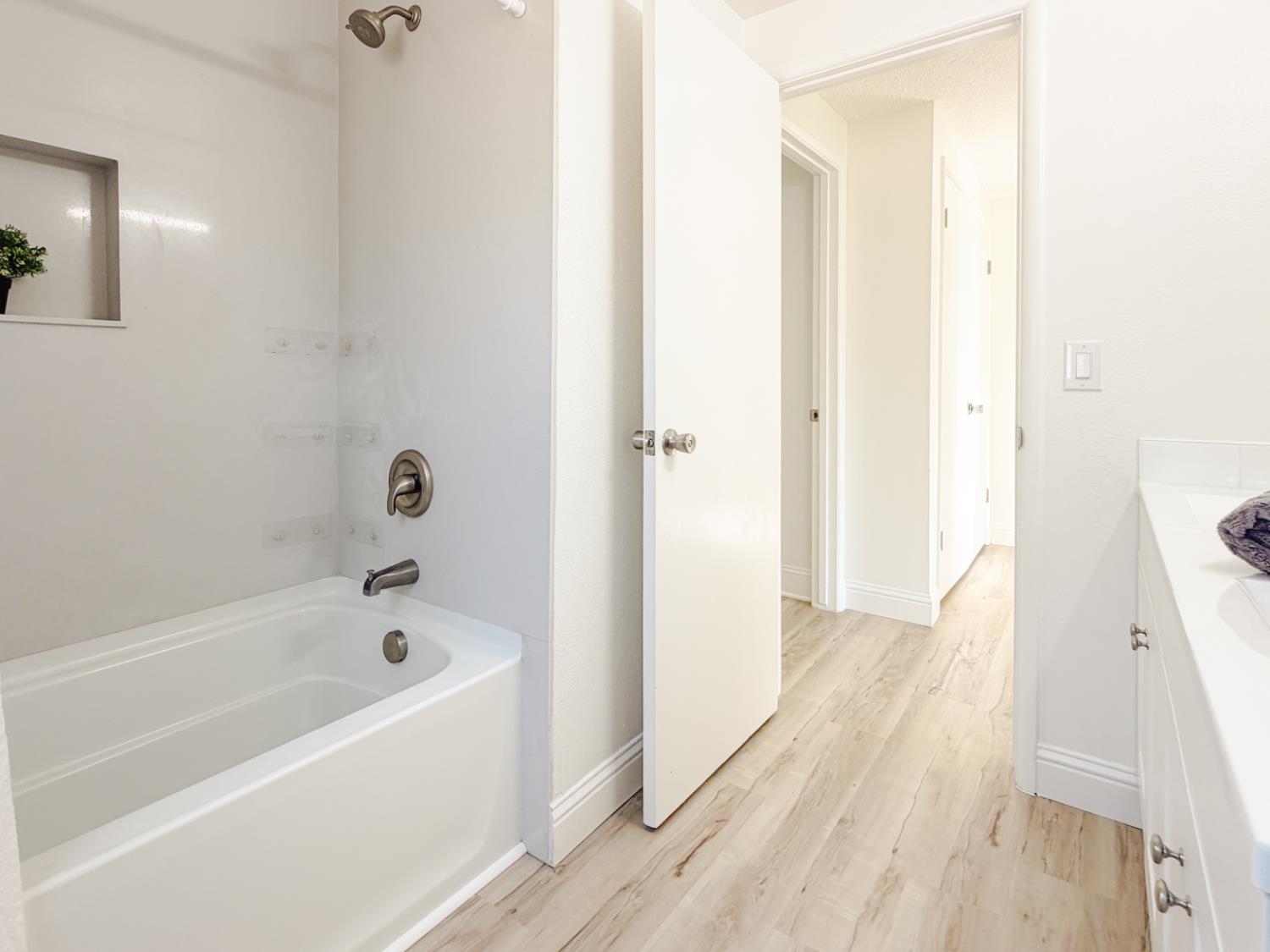 878 Carol Avenue Merced, CA 95341 - Photo 26 of 41 a bathroom with a bathtub and a shower