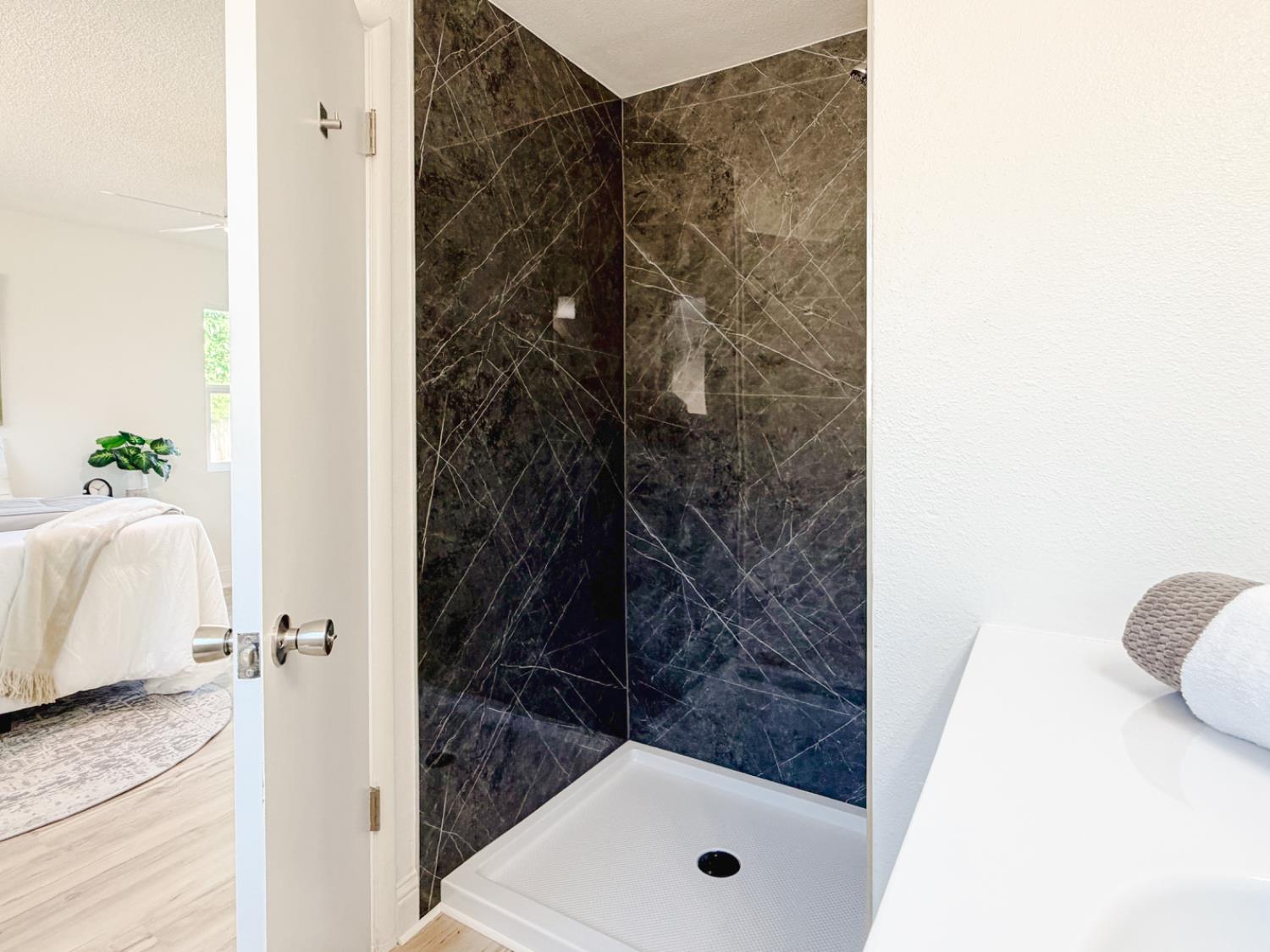 878 Carol Avenue Merced, CA 95341 - Photo 31 of 41 a bathroom with a shower