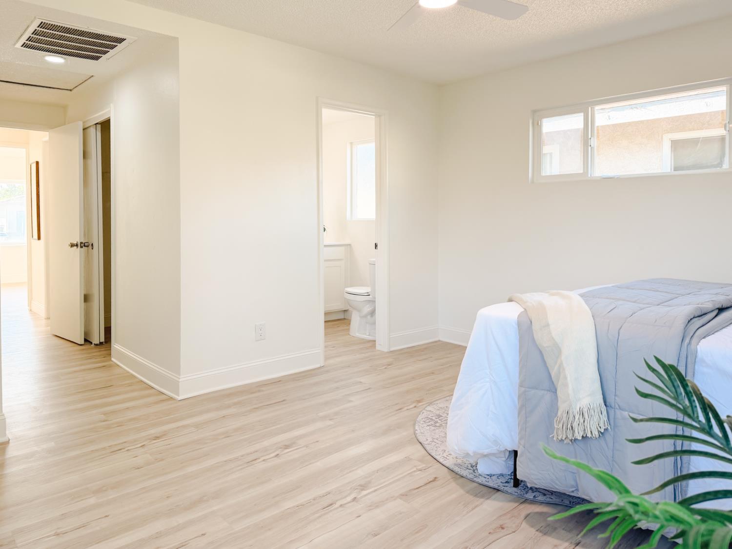 878 Carol Avenue Merced, CA 95341 - Photo 32 of 41 a view of a bedroom with wooden floor and small space
