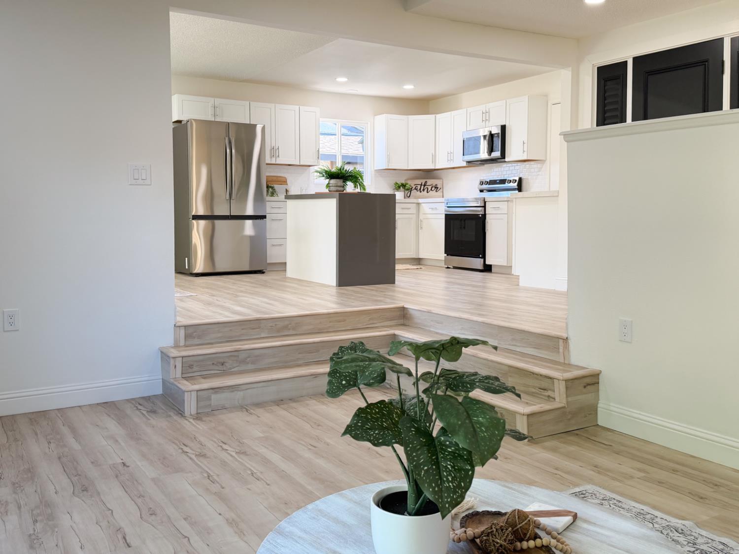 878 Carol Avenue Merced, CA 95341 - Photo 8 of 41 a living room with stainless steel appliances furniture a refrigerator and a kitchen view