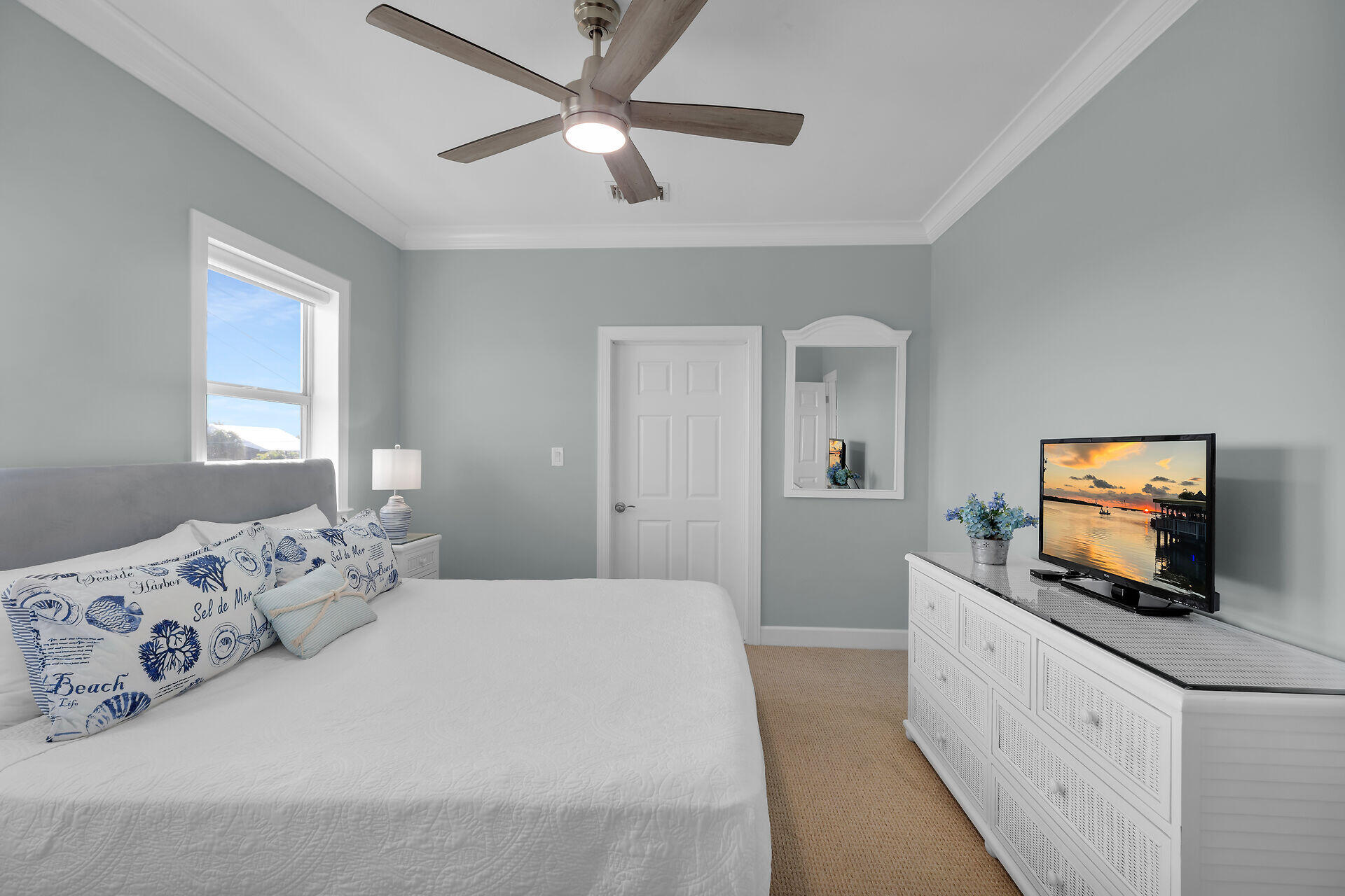 580-590 10th Street Key Colony Beach, FL 33051 - Photo 38 of 75 a bedroom with a bed and a flat screen tv