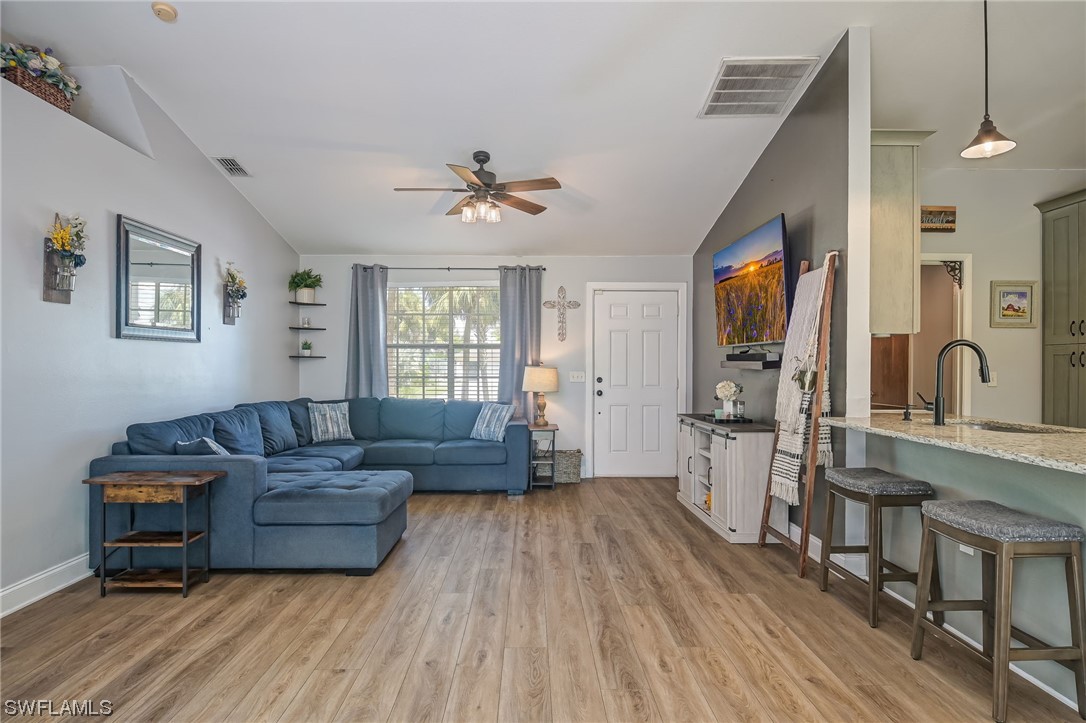 15780 Cemetery Road Fort Myers, FL 33905 - Photo 3 of 39 a living room with furniture and a wooden floor