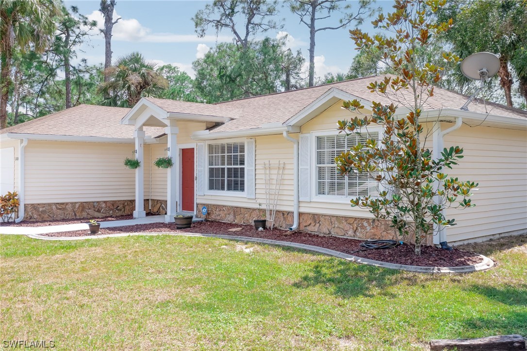 15780 Cemetery Road Fort Myers, FL 33905 - Photo 32 of 39 a house view with swimming pool and garden space