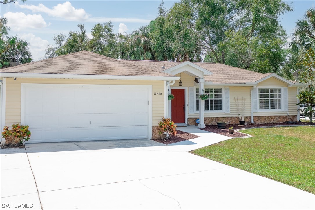 15780 Cemetery Road Fort Myers, FL 33905 - Photo 33 of 39 a backyard of a house with yard and outdoor seating