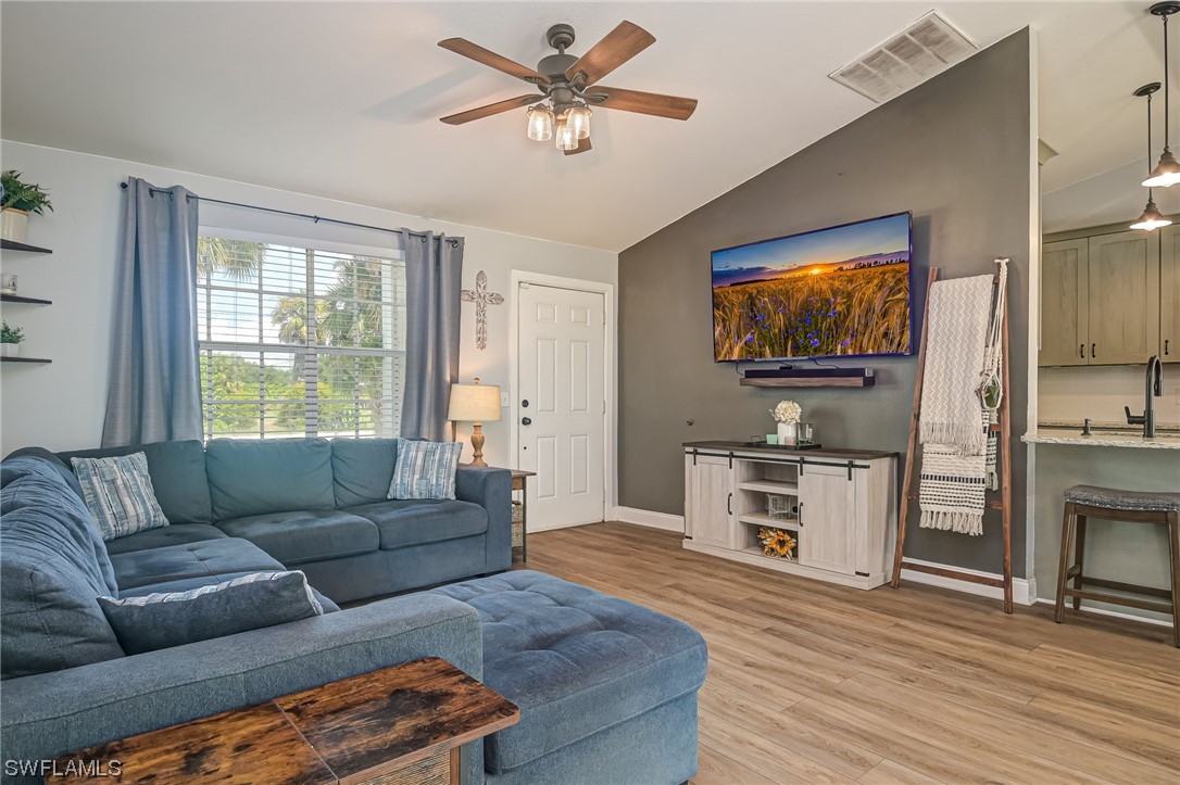 15780 Cemetery Road Fort Myers, FL 33905 - Photo 4 of 39 a living room with furniture and a flat screen tv
