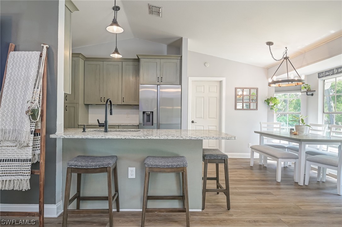15780 Cemetery Road Fort Myers, FL 33905 - Photo 9 of 39 a kitchen with center island table and chairs