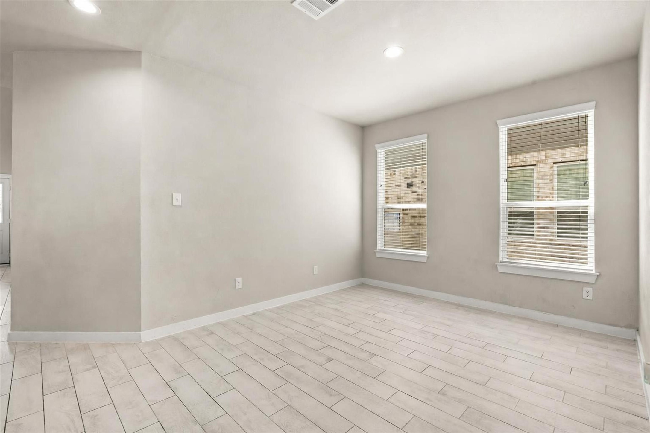 22939 Aspen Vista Dr Spring Spring, TX 77373 - Photo 13 of 29 Perfectly positioned just off the kitchen, the formal dining room offers a welcoming space for everyday meals, holiday celebrations, and memorable gatherings.