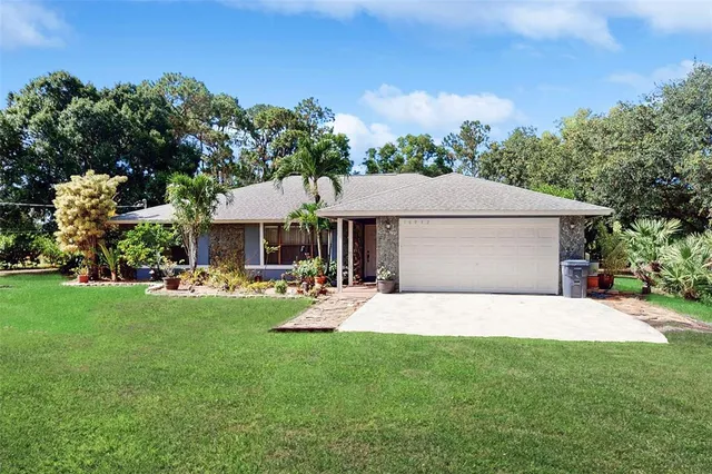 a view of a house with a yard porch and sitting area