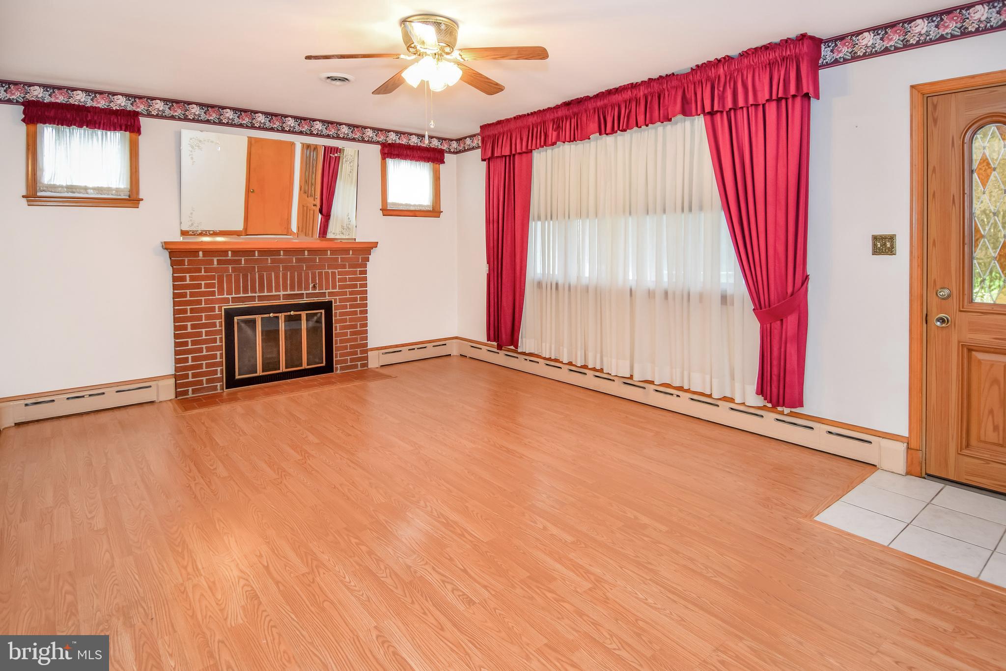 4501 Ridge Road Baltimore, MD 21236 - Photo 4 of 27 Living Room w/ Wood Fireplace