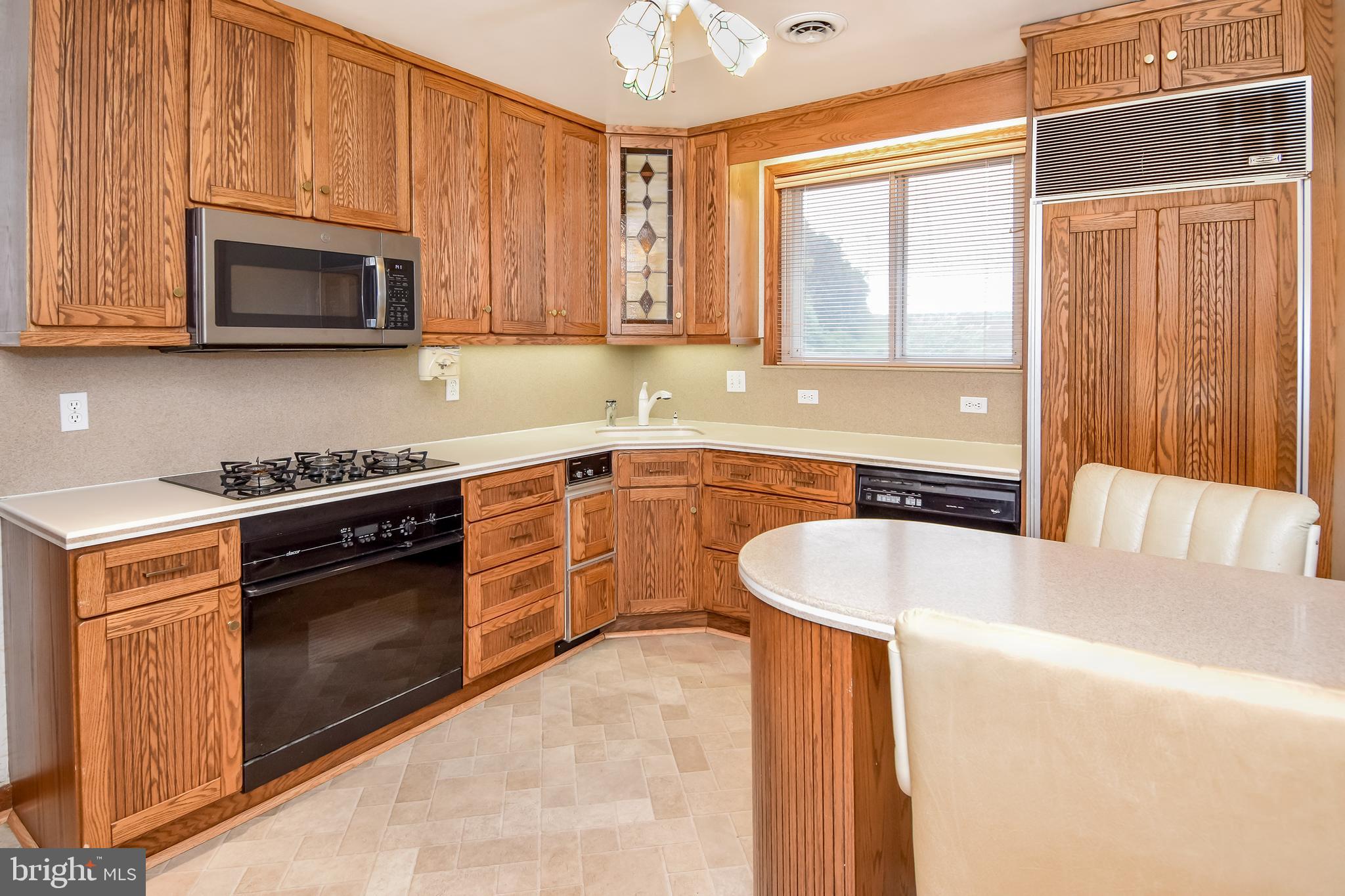 4501 Ridge Road Baltimore, MD 21236 - Photo 8 of 27 Kitchen Has Oak Cabinets