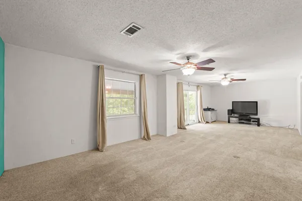 a view of a livingroom with a flat screen tv
