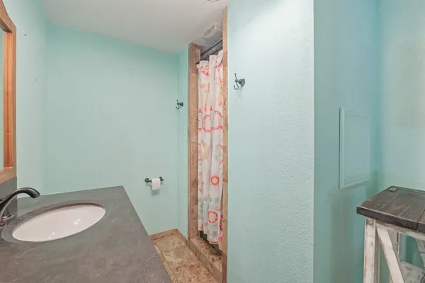 a bathroom with a sink and a mirror