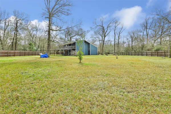 a view of a field with an trees