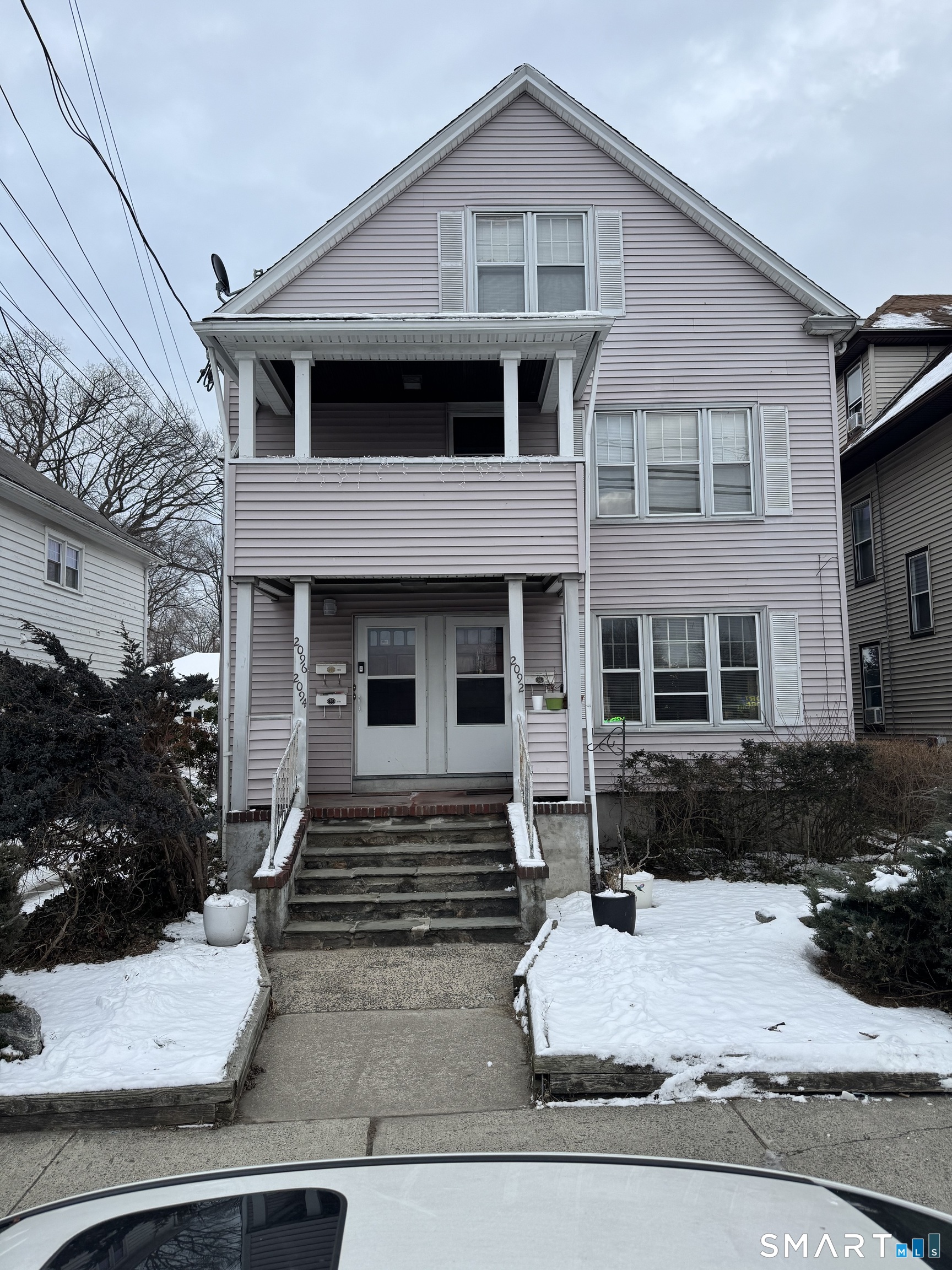2092 East Main Street Bridgeport, CT 06610 - Photo 1 of 2 a front view of a house with garden