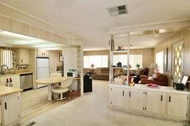 a view of a lobby with furniture and a window