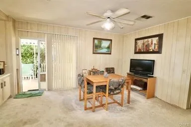 a view of a livingroom with furniture and a flat screen tv