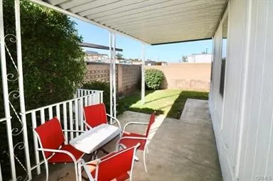 a view of an outdoor sitting area with furniture