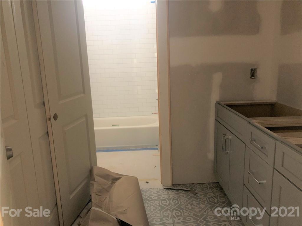 5520 Closeburn Road Charlotte, NC 28210 - Photo 26 of 32 a bathroom with a sink and vanity