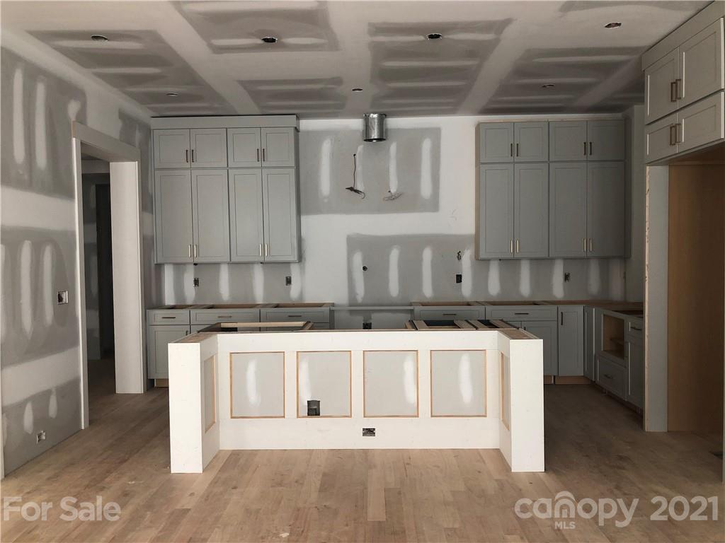 5520 Closeburn Road Charlotte, NC 28210 - Photo 7 of 32 a view of a kitchen with stainless steel appliances wooden cabinets and a counter top space