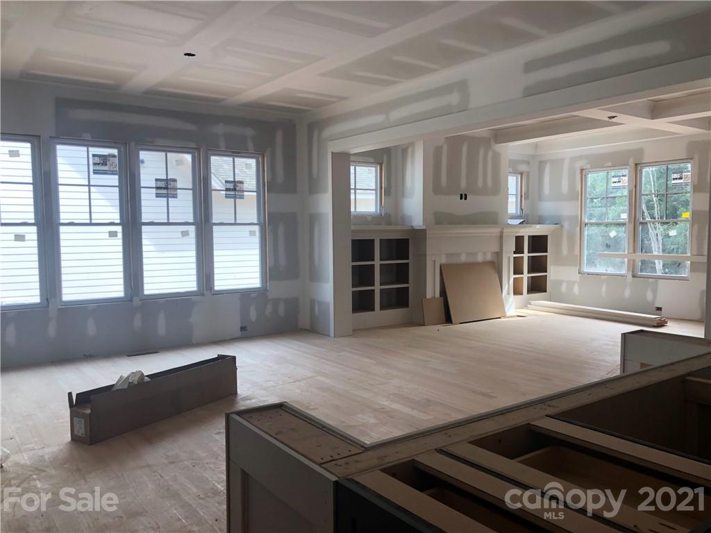 5520 Closeburn Road Charlotte, NC 28210 - Photo 8 of 32 a living room with fireplace furniture and a large window