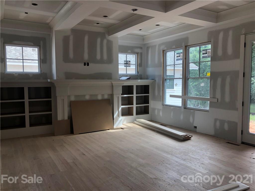 5520 Closeburn Road Charlotte, NC 28210 - Photo 10 of 32 a view of an empty room with a window and wooden floor