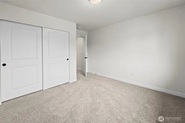 a spacious bathroom with a double vanity sink mirror and toilet