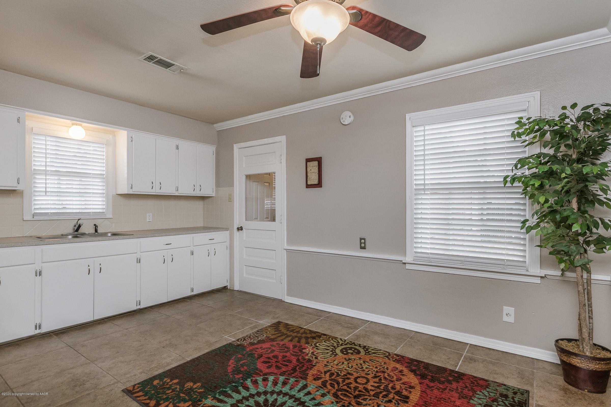 4301 South Jackson Street Amarillo, TX 79110 - Photo 7 of 18 a large white kitchen with a window