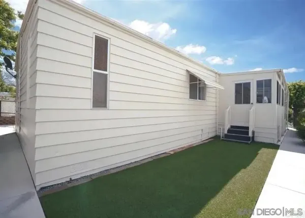 a view of a backyard with a garden