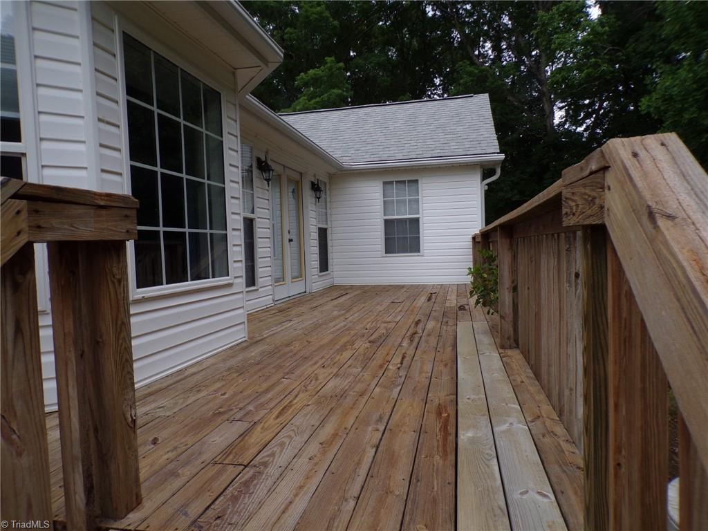 6236 Nat Road Julian, NC 27283 - Photo 28 of 34 Back Deck with access from back garage door.