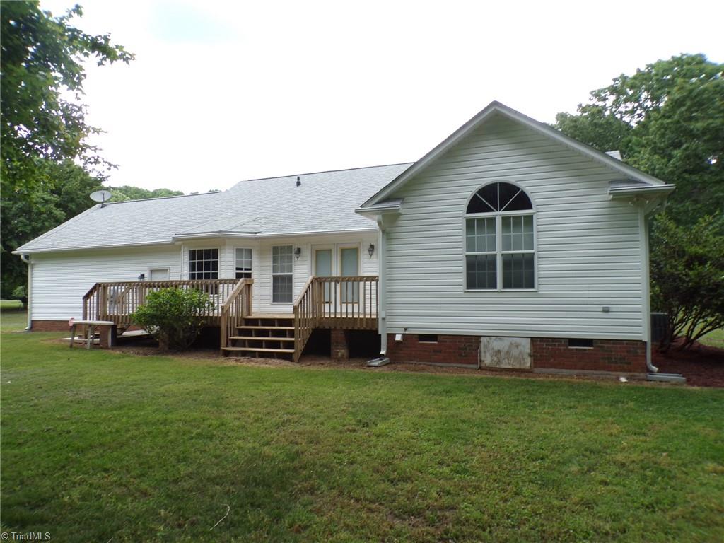 6236 Nat Road Julian, NC 27283 - Photo 29 of 34 Back view shows primary bedroom with large window.