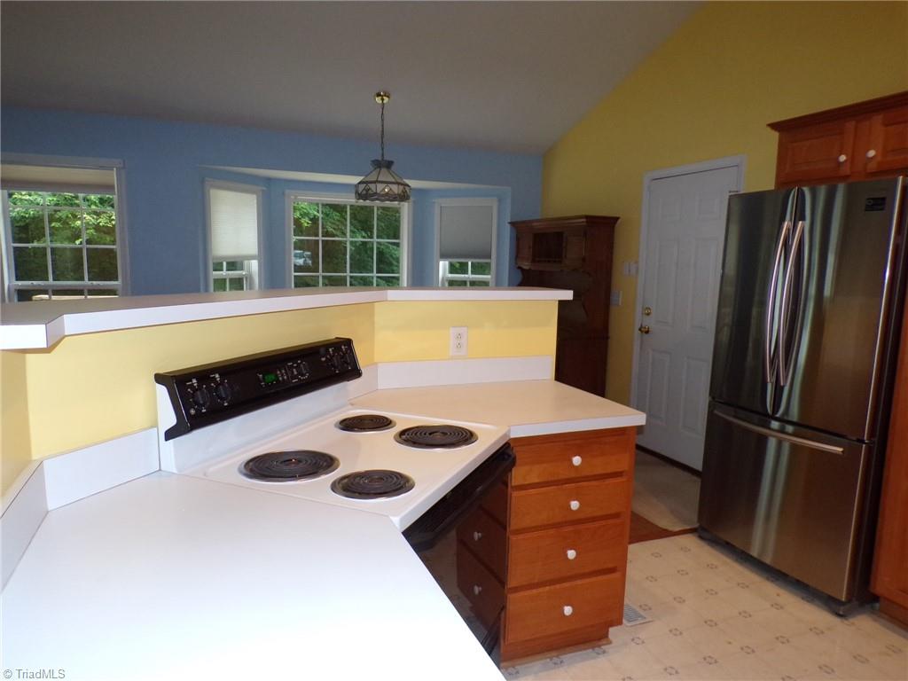 6236 Nat Road Julian, NC 27283 - Photo 7 of 34 Kitchen is open to the living spaces.